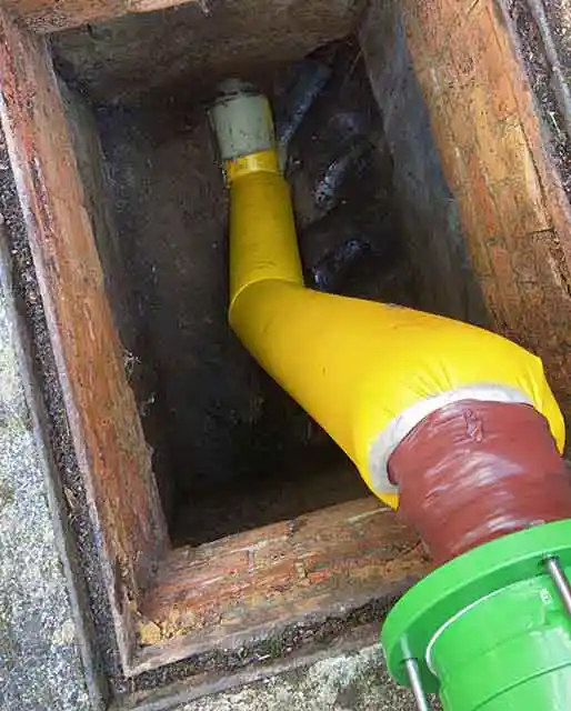 Cured in place pipe lining via manhole